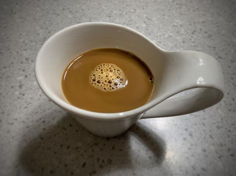 Top view of white ceramic coffee mug. Morning time concept