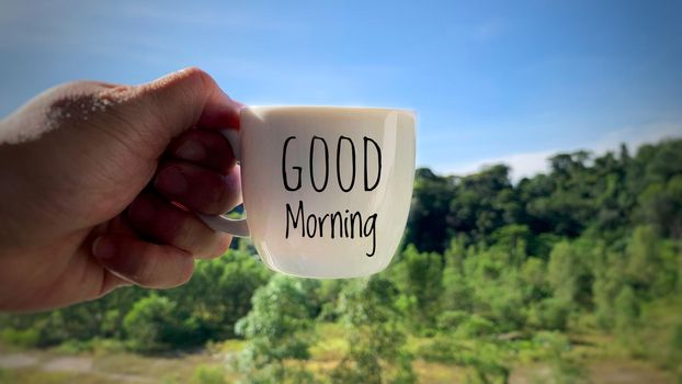 Good morning text on coffee cup. Morning greeting concept