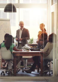 Shot of a group of coworkers in a boardroom meeting