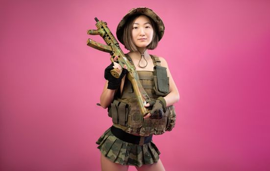 the asian woman in a jacket with an automatic rifle in her hands mafia fighter