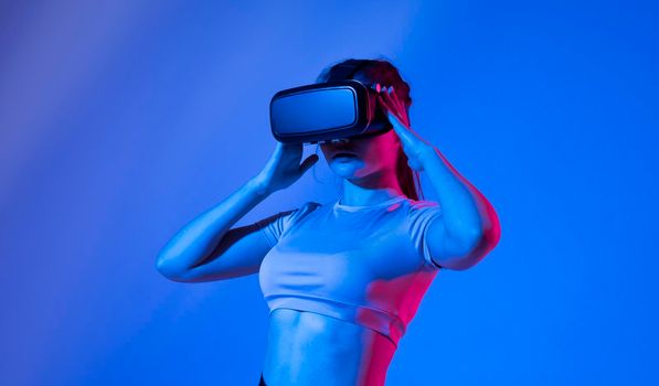 Female architector wearing virtual reality headset and making gestures with hands. VR technology for industrial design, development, architecting