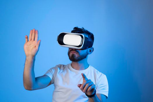 Young man developer, designer or architect working with a VR headset in a virtual space and create new products, applications or working on a new design or architecture project