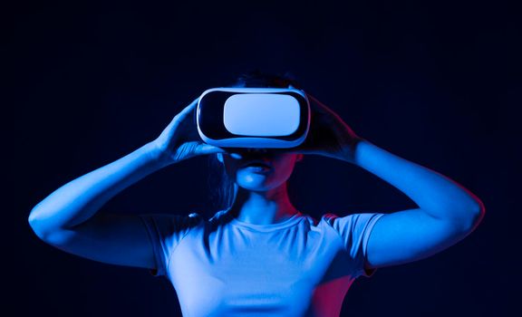 Young woman developer, designer or architector using VR headset to designing a new products or technologies using VR technology. Future technology concept