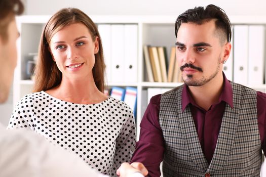 A married couple at a clinic reception, close-up. Reproductive medicine, preparation for conception, consultation