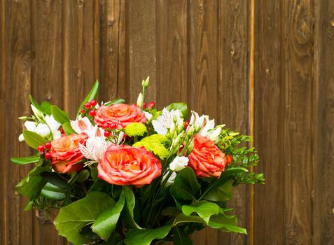 bouquet of flowers on a old wooden background with copy space