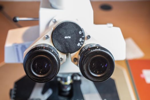 scientific microscope with eyepieces and lenses