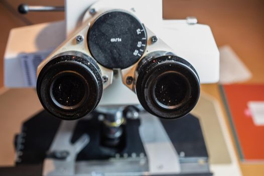 scientific microscope with eyepieces and lenses