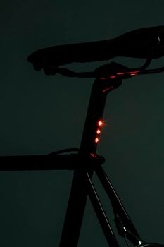 Vintage road bicycle, restored. Integrated led on seat tube. Dark mood, technological. High quality photo