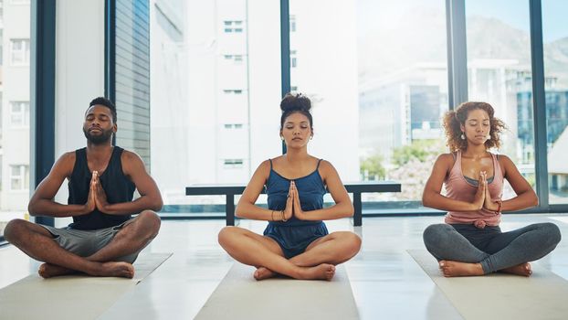 Shot of a group of people doing yoga
