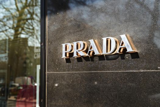Brussels, Belgium - April 1 2019: Logo of Prada by the store showcase
