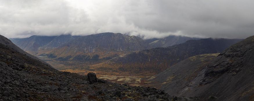 The clouds caught on the tops of the mountains. Low clouds in the mountains. Khibiny, Russia. photo