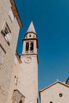 ld Town, Budva, Montenegro. Picturesque square in the well preserved medieval Old town with shops, cafes and restaurants in the Balkans. The view of Budva medieval fortress of St. Mary, Citadel, landscape of Old town Budva, Montenegro: ancient walls, beautiful Landscape