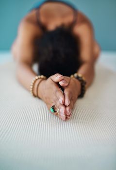 Shot of a young woman practising yoga