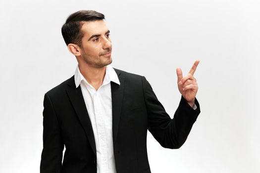successful man thumbs up copy-space posing self-confidence business and office concept. High quality photo