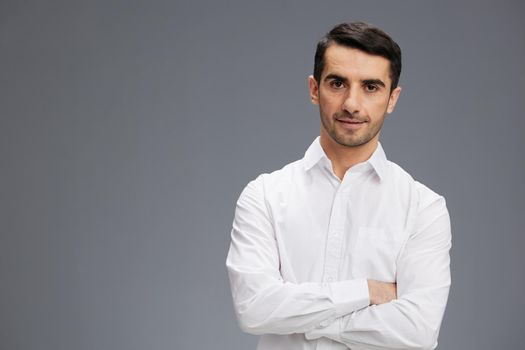handsome businessman in a white shirt a pensive look business and office concept. High quality photo