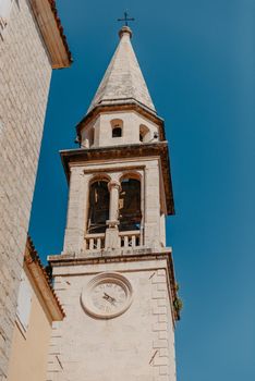 ld Town, Budva, Montenegro. Picturesque square in the well preserved medieval Old town with shops, cafes and restaurants in the Balkans. The view of Budva medieval fortress of St. Mary, Citadel, landscape of Old town Budva, Montenegro: ancient walls, beautiful Landscape