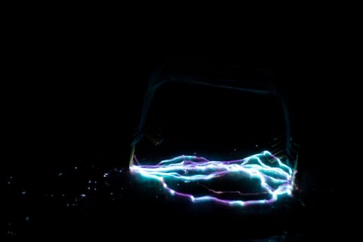 blue and purple taser electric discharge on black. High quality photo