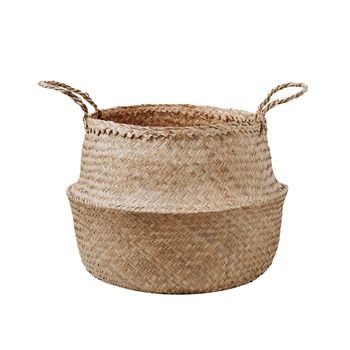 Empty trendy design handwoven seagrass belly basket with handles for storage laundry and toys or can use as cachepot. Round storage basket in braided seagrass, isolated on white background with clipping path