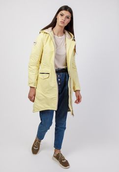 young woman in winter clothes on white background. Photo concept for advertising a down jacket.