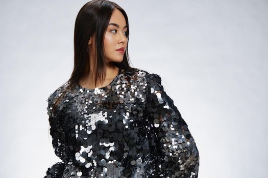 young woman shiny jacket fashion posing luxury studio model. High quality photo