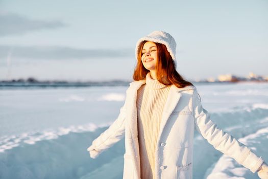 woman red hair snow field winter clothes Fresh air. High quality photo