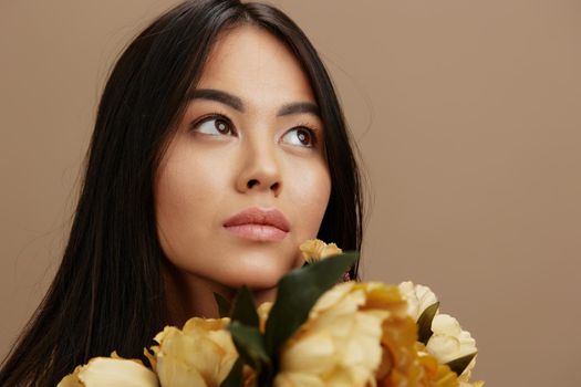 Brunette with a bouquet of flowers romance luxury Lifestyle close up. High quality photo