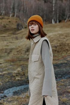 woman in the autumn forest walk fresh air travel landscape. High quality photo