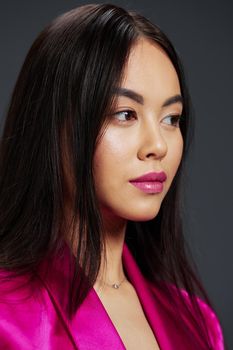 woman bright makeup pink dress modern style studio model. High quality photo