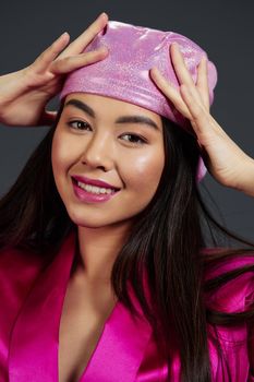 Brunette posing pink mini dress charm headscarf isolated background. High quality photo