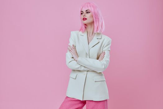 Beauty Fashion woman attractive look white blazer pink wig pink background unaltered. High quality photo