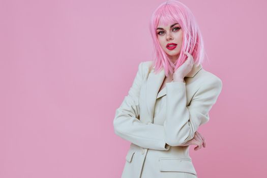 Portrait of a charming lady in White blazer pink hair Glamor Cosmetics pink background unaltered. High quality photo