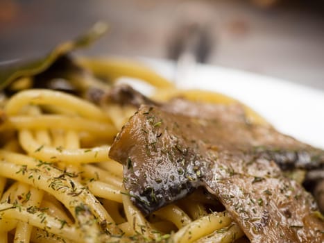 tasty Italian pasta with mushrooms close up.