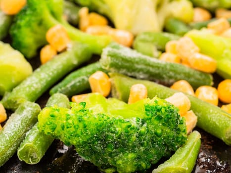 frozen vegetables broccoli corn green beans closeup.