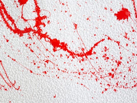 red blot and splashes of paint on a white background. expressionism