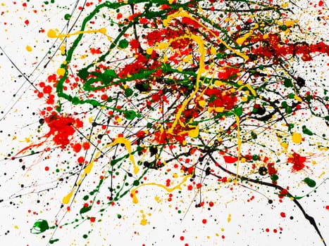 an abstraction with splashes of black and red and green and yellow paint on a white background