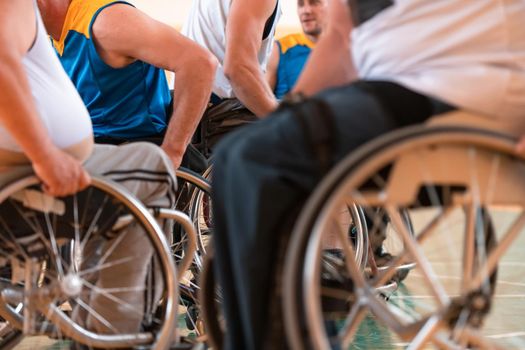 Close-up of sportsman with disability sitting in wheelchair playing basketball. High quality photo