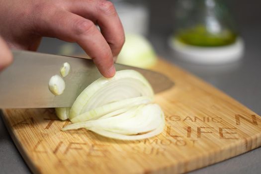 cut onion on a wooden table for savoury recipe, omelette, vegan, vegetarian, vegetarian