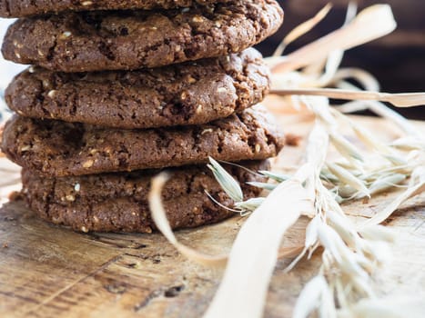 oatmeal cookies oats and milk on a wooden background.