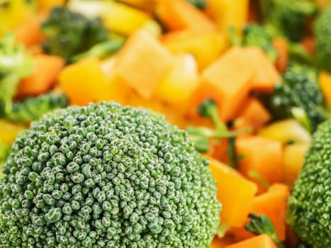 raw broccoli salad with bell peppers and carrots.