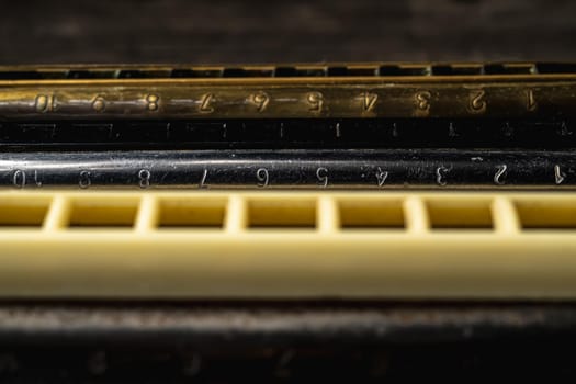 musical instruments vintage harmonics diatonic and chromatic on old wooden desk. world music day. Horizontal orientation.