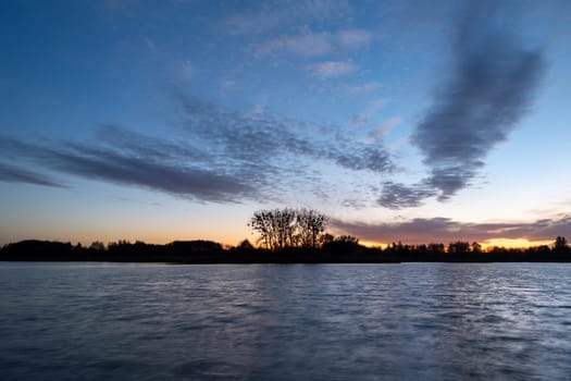 Small clouds after sunset on the lake, Stankow, Poland