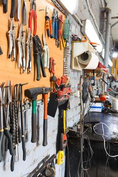 A set of tools in the real auto repair shop. The organization of the workplace at the mechanic.