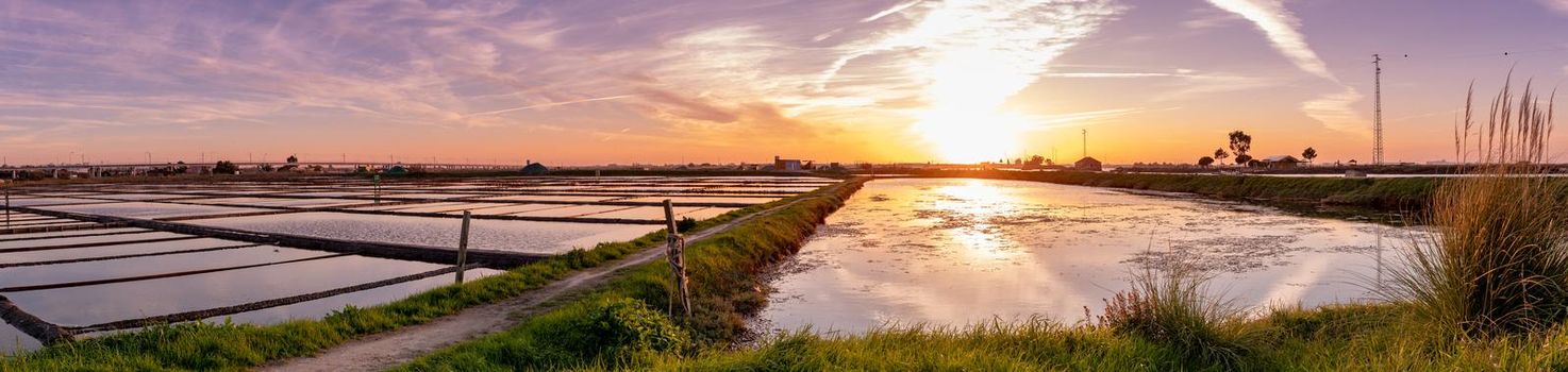 Sunset view over the salt flats of Aveiro, Portugal.