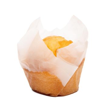 Closeup of a Magdalena Typical Spanish Plain Muffin. Sweet Food or Dessert. Fresh Baked Muffin Isolated on White Background in American Style. Irresistible Tasty Cake.