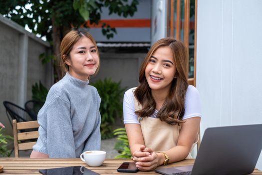 Friends Teenager Buddies Concept. Asian teen meeting at cafe and looking for friends coming