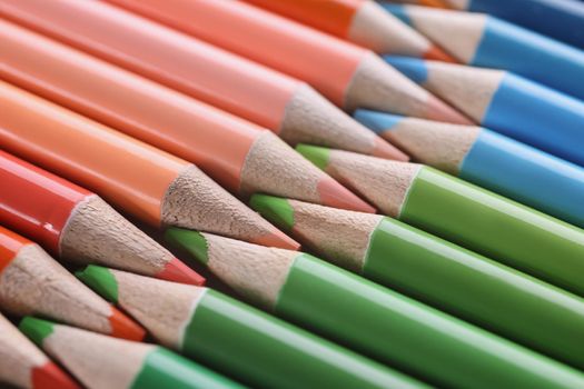 Macro sharpened red green blue pencils, close-up. Colored graphite rod, education, creativity, fine arts