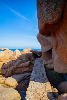 Pink Granite Coast is a stretch of coastline in the Cotes d Armor departement of northern Brittany, France. It stretches for more than thirty kilometres.