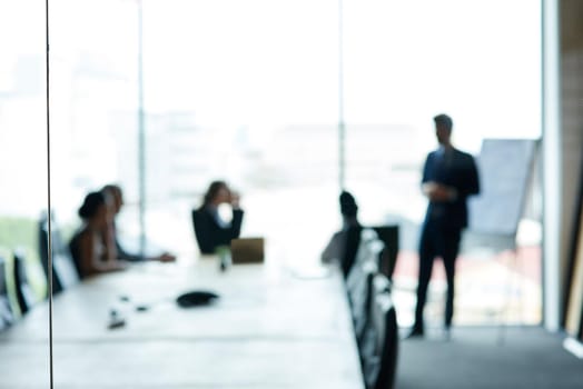 Shot of a group of executives having a meeting in a boardroom