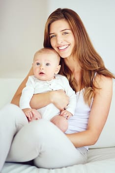 Shot of a young mother bonding with her adorable baby boy at home
