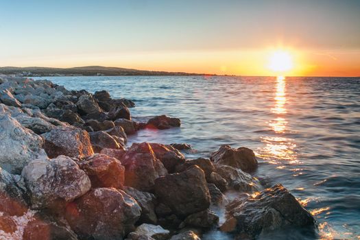 Rocky coastline and blue sky on island Vir, Croatia. Evening sunset with pastel colours of sky.